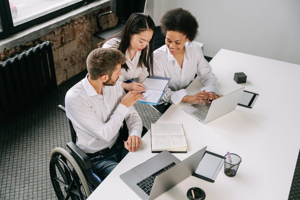 Employees Looking at the Notepad
