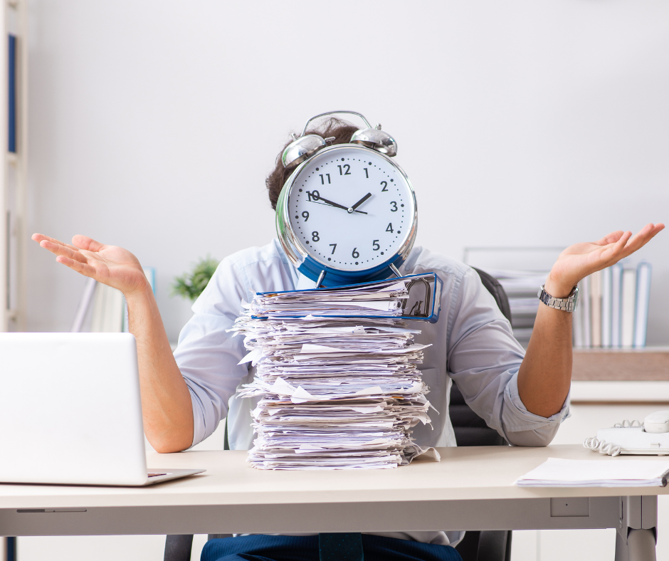 A person sits at a desk with a large stack of papers labelled "HR policy templates," shrugging as a clock covers their face, suggesting stress or overwhelm with time management.